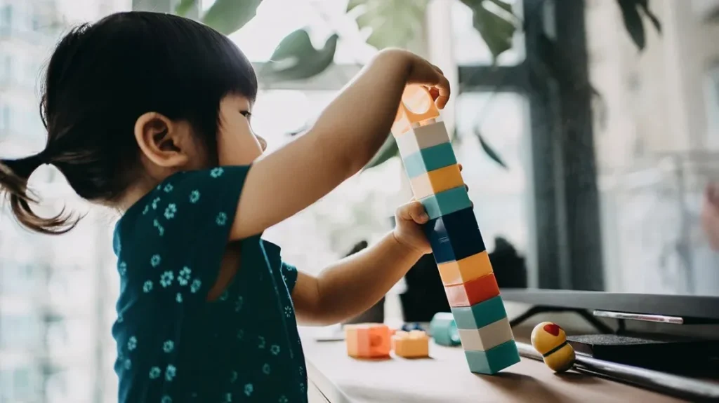 child playing with blocks ABA therapy session